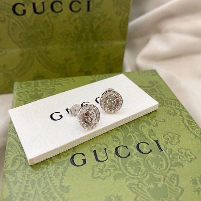 G*u*i earrings